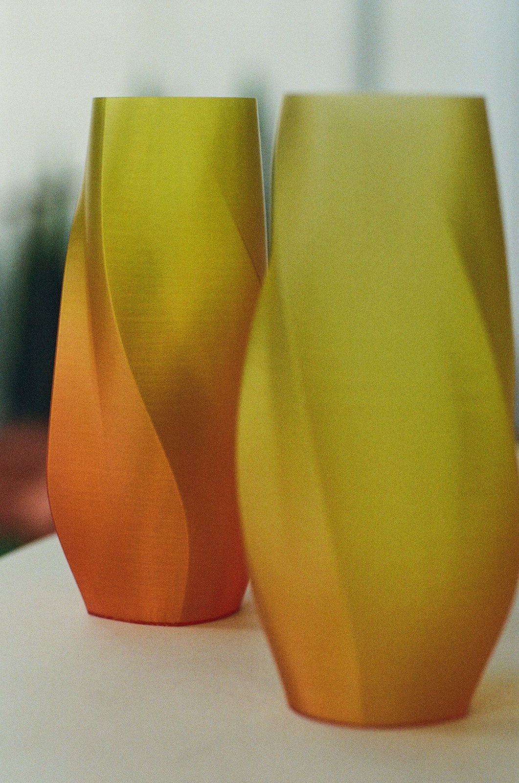 Two gradient vases, yellow to orange