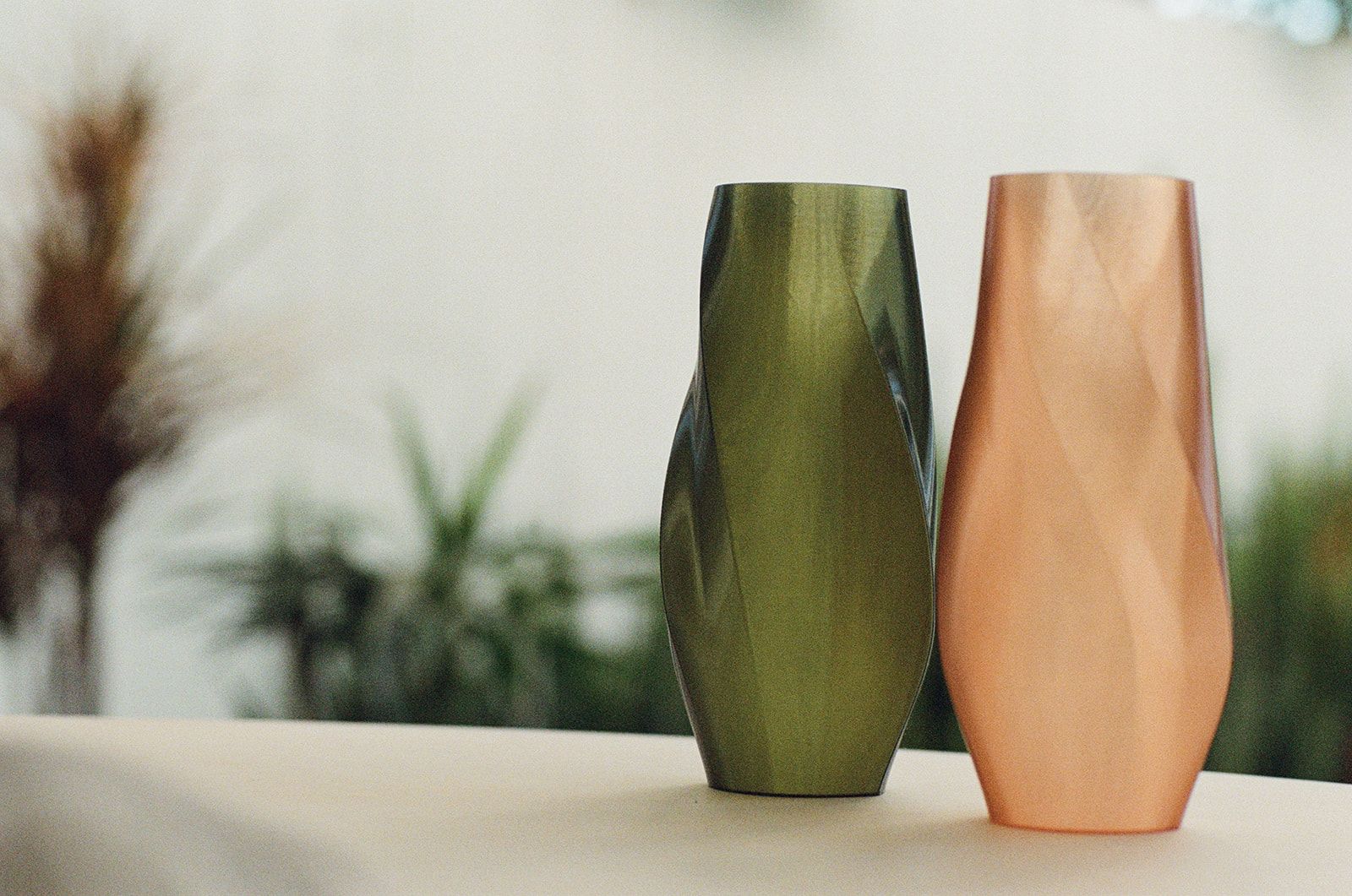 Green and peach vases, paired